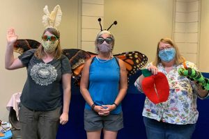 Three women dressed as a moth, a butterfly and a caterpillar