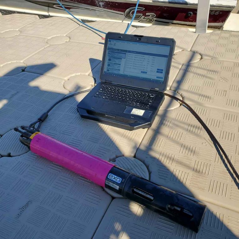 A laptop downloads data from a water quality sonde. 