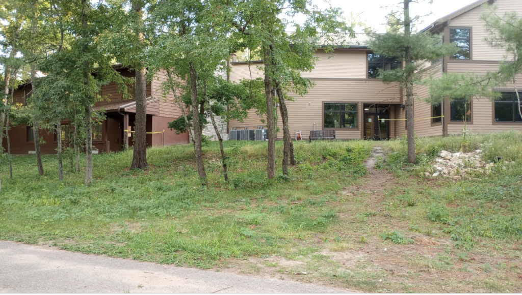 Grassy area on hill next to Upham Woods Outdoor Learning Center