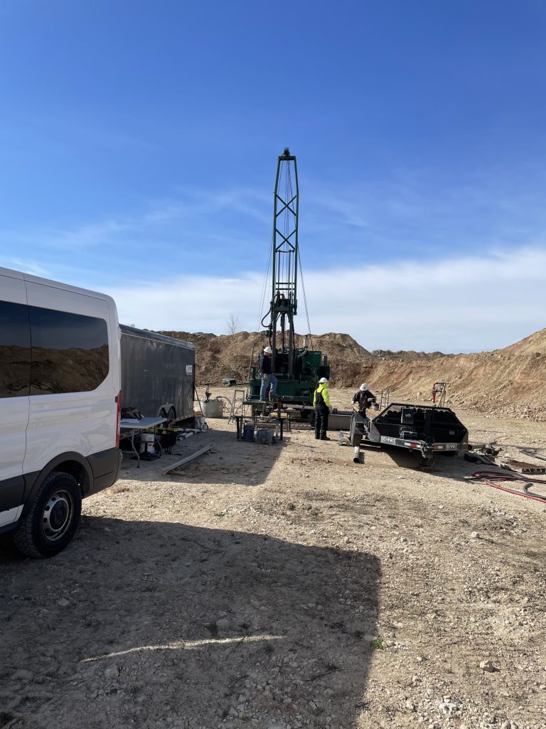 Drill rig set up near Brant, WI. The drill pipe is on the right trailer, while supplies and shelter are in the left trailer.