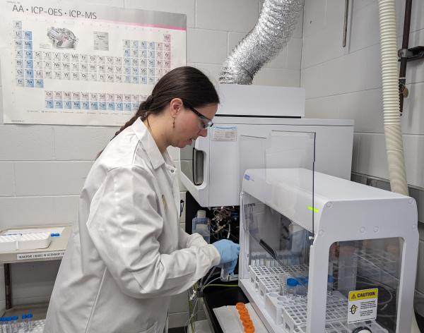 A women in a lab testing water quality