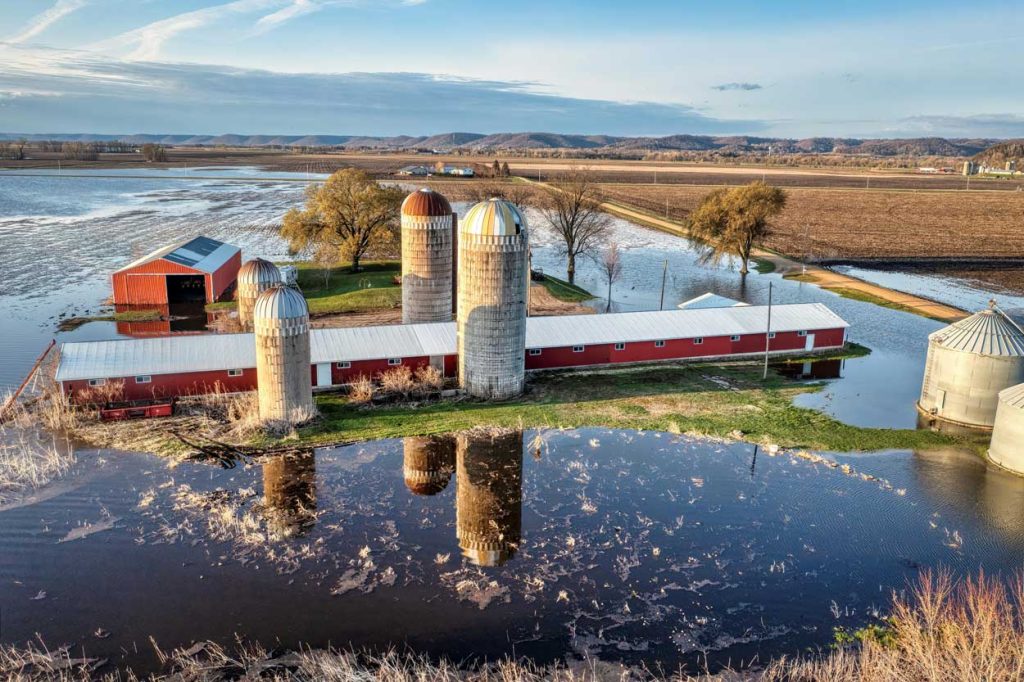 A farm that is surrounded by flood waters