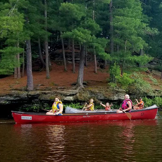 Kids canoeing in a river