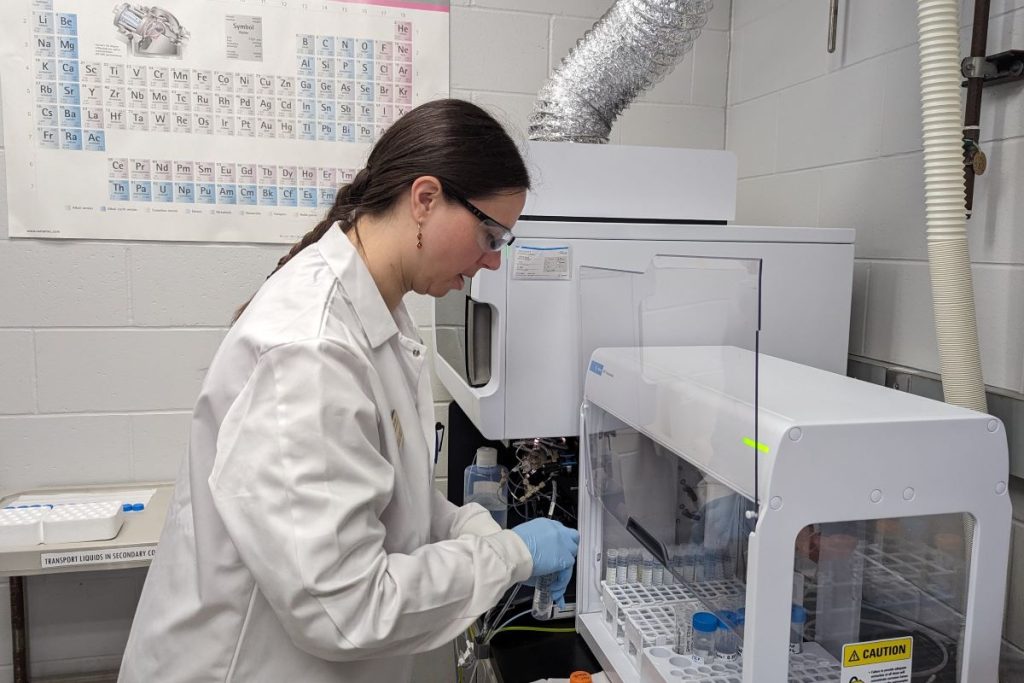 A woman conducting water testing in the WEAL lab